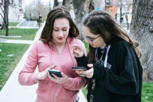 Two teenaged girls on their cell phones