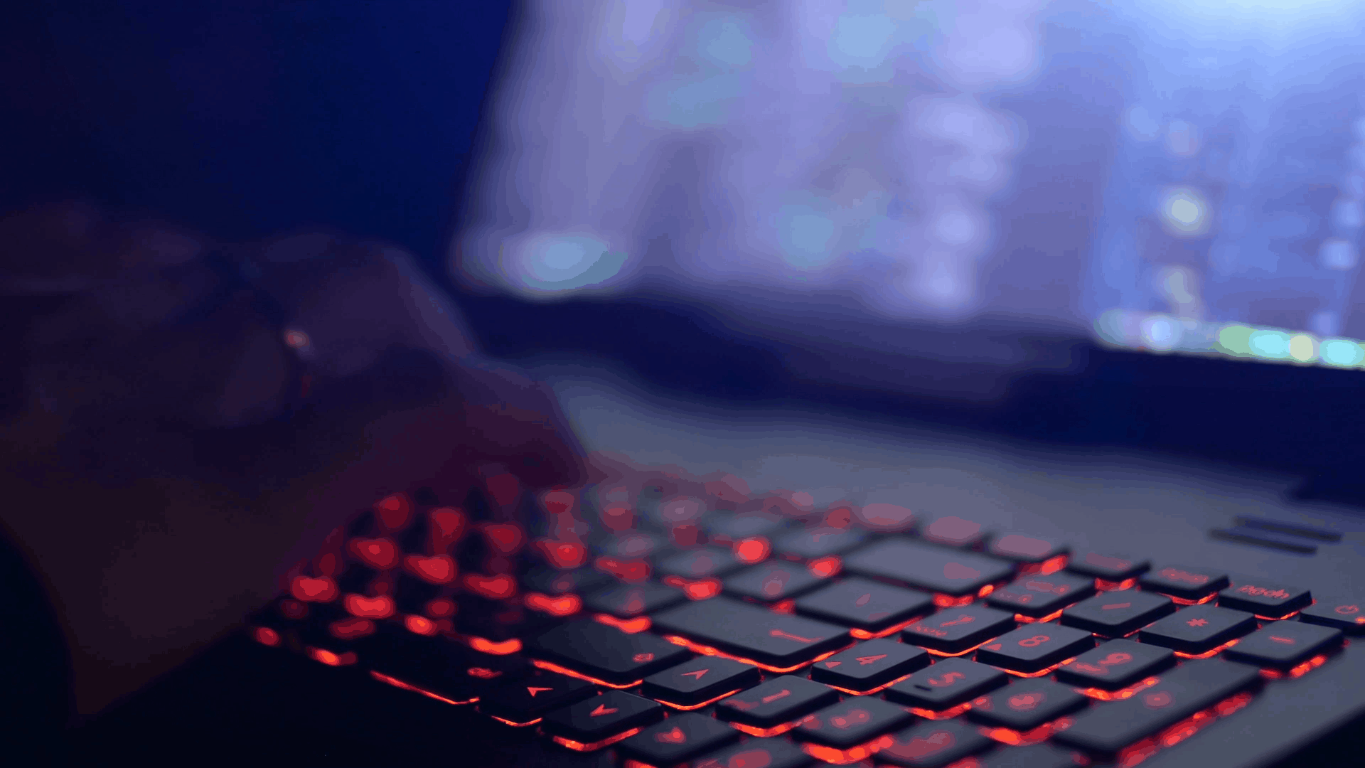 A laptop in a darkened room