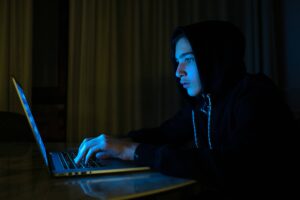 teenage boy in front of computer screen