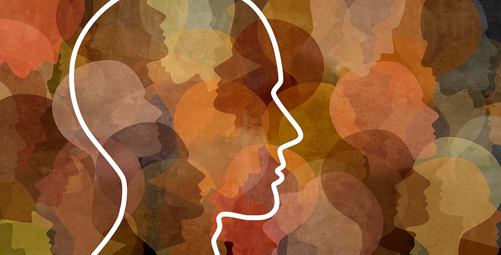Silhouette with other faces behind to represent the diversity of human trafficking victims