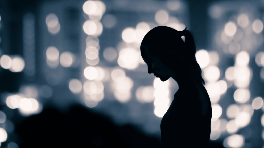 Silhouette of sad woman