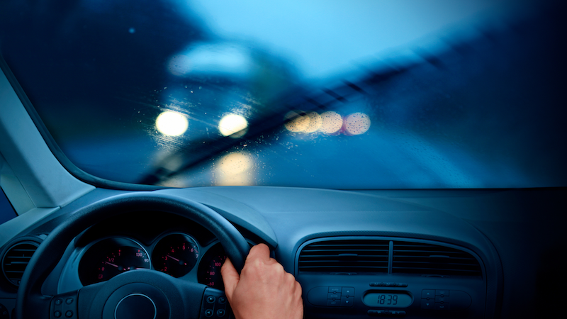 A car driving at night, from the point of view of the driver