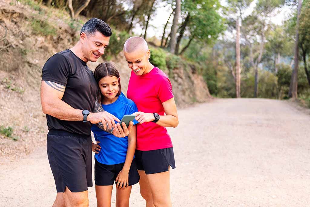 Family using phone for fitness challenge